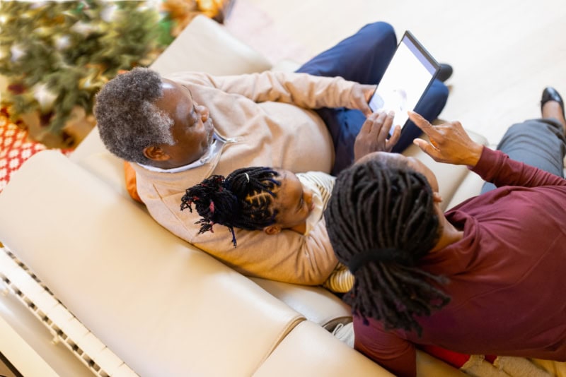 Grandparents and granddaughter having video call. It's a Christmas time